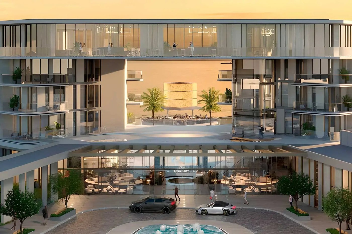 Hotel atrium with palm trees and a view of the sea