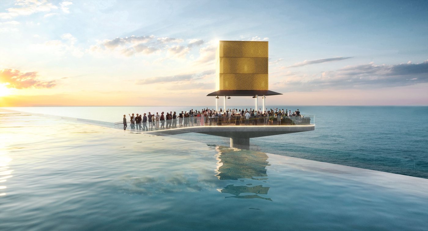 Golden cube venue above the sea at sunset next to an infinity pool